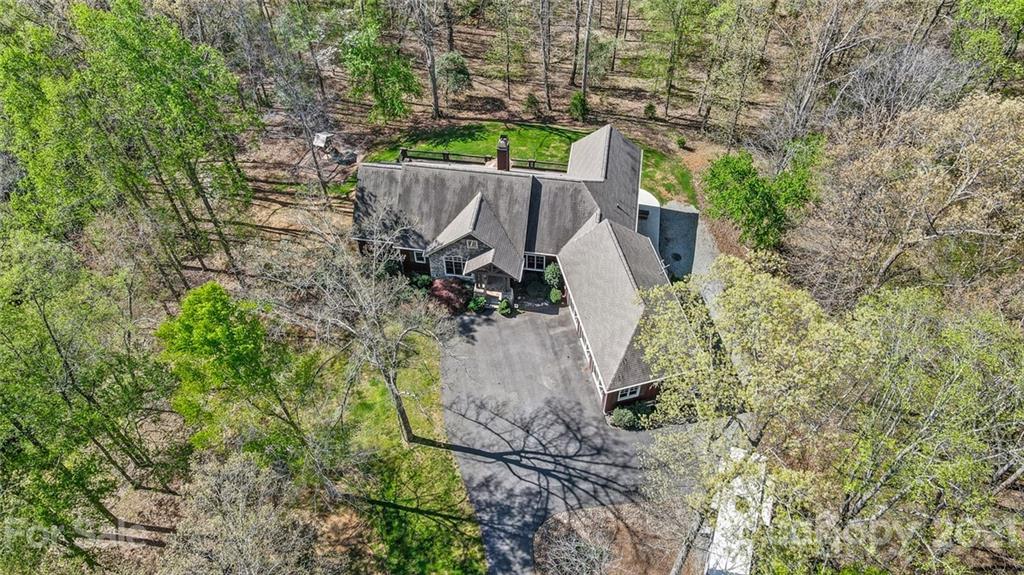 215 Eagle Cove Drive Cherryville, NC 28021 - Photo 46 of 48 a view of a yard with plants and large trees