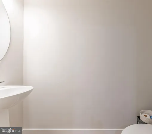 a bathroom with a sink and mirror
