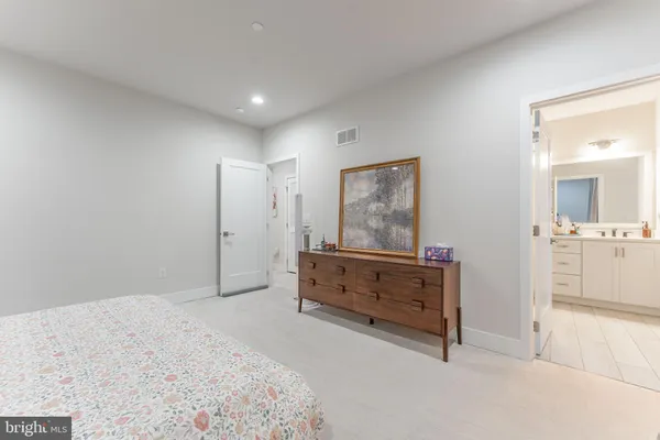 a bathroom with a double vanity sink mirror and shower