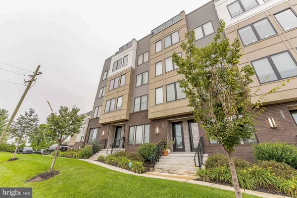 a view of a building with a yard