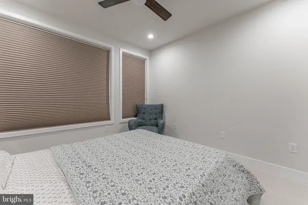 a bedroom with a bed and a couch