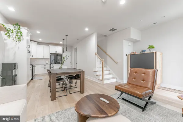 a kitchen with a table and chairs in it