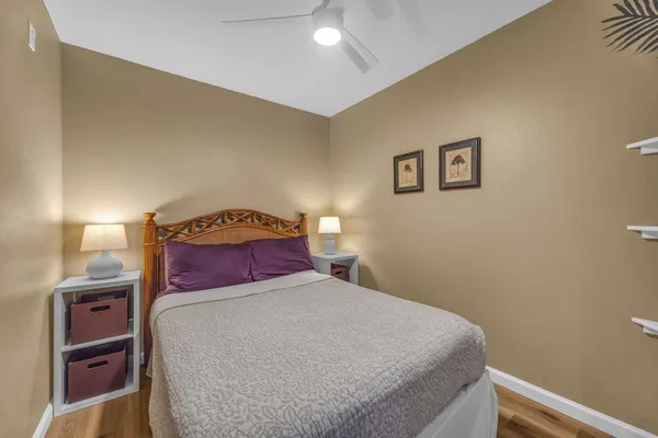 a bedroom with a bed and a lamp