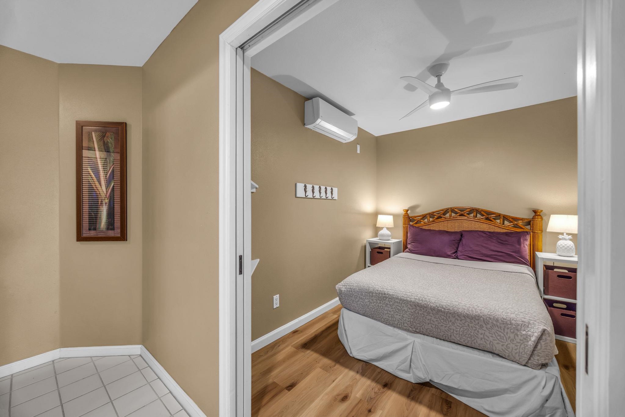 2777 South Kihei Road, Unit L105 Kihei, HI 96753 - Photo 16 of 48 a bedroom with a bed and lamps