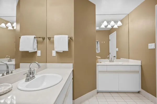 a bathroom with a sink double vanity and a mirror