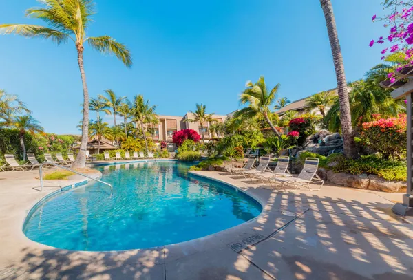 a view of a swimming pool with a patio