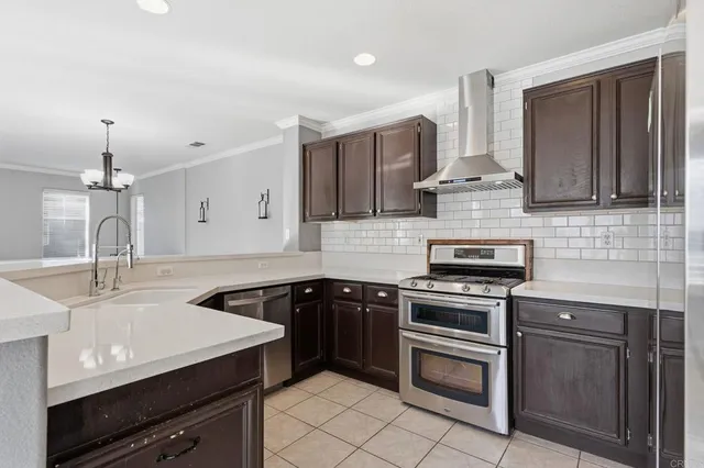 a kitchen with a sink stove and microwave