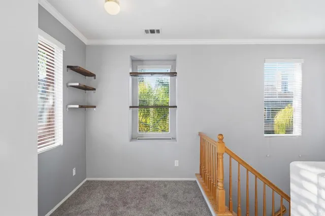 a view of hallway with windows