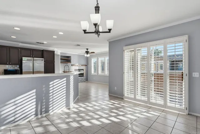 a view of a kitchen with furniture and a large window