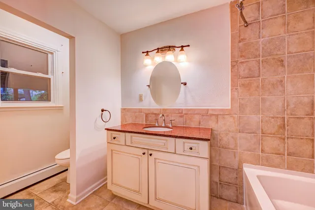 a bathroom with a sink a vanity and a mirror