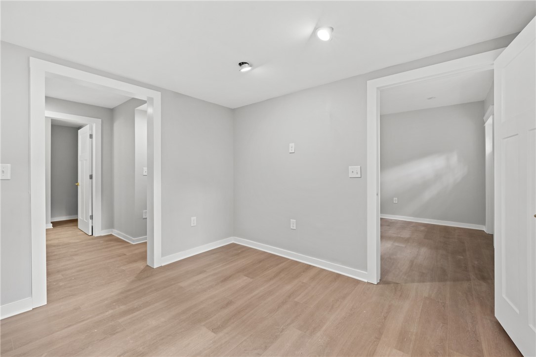 309 Woodland Way Clemson, SC 29631 - Photo 37 of 43 This versatile room features light wood flooring and bright recessed lighting, offering an adaptable space for various needs.