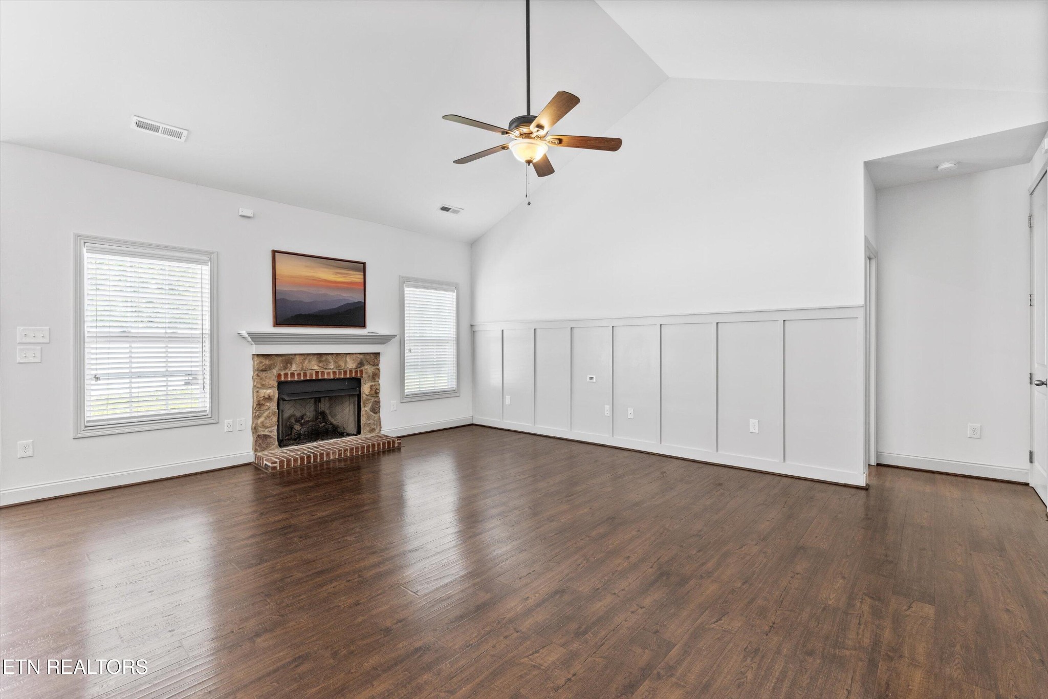 105 Cascade Lane Oak Ridge, TN 37830 - Photo 8 of 39 a view of a livingroom with a fireplace a ceiling fan and wooden floor