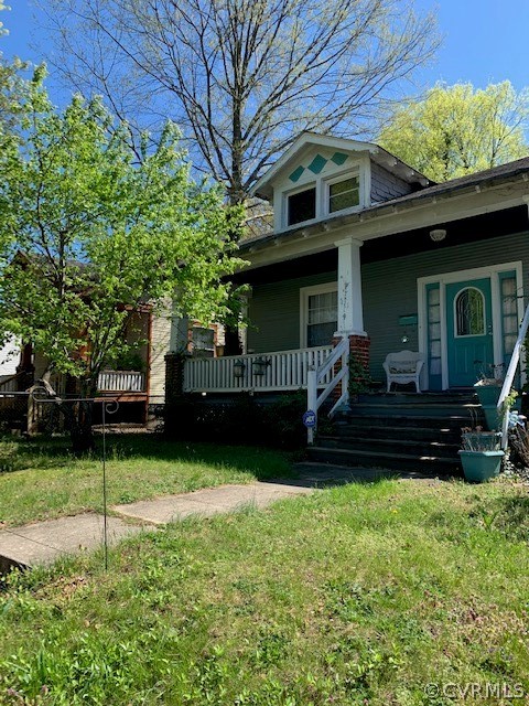 511 Pollock Street Richmond, VA 23222 - Photo 1 of 4 a view of a house with a yard