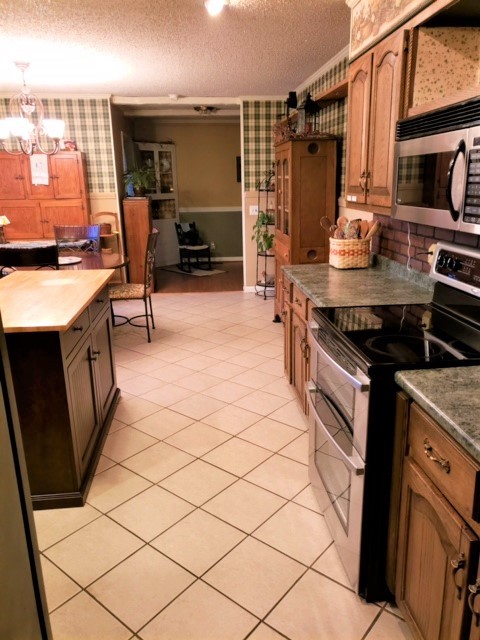 1931 Jarrell Road Lebanon, TN 37087 - Photo 11 of 35 a kitchen with stainless steel appliances a stove a sink and a refrigerator