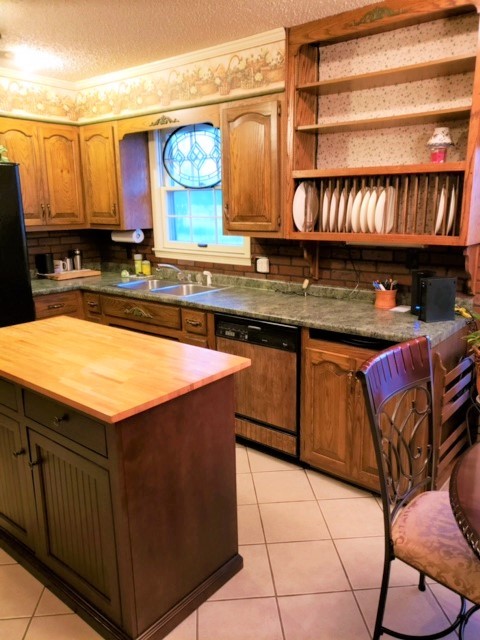 1931 Jarrell Road Lebanon, TN 37087 - Photo 26 of 35 a kitchen with stainless steel appliances granite countertop a sink and cabinets