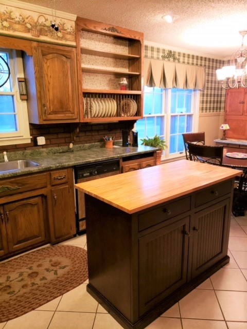 1931 Jarrell Road Lebanon, TN 37087 - Photo 6 of 35 a kitchen with stainless steel appliances granite countertop a sink stove and cabinets