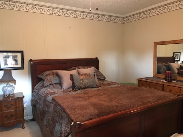 1931 Jarrell Road Lebanon, TN 37087 - Photo 10 of 35 a bed sitting in a bedroom next to a window with lamp