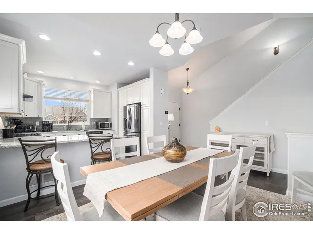 a view of kitchen with dining table and chairs