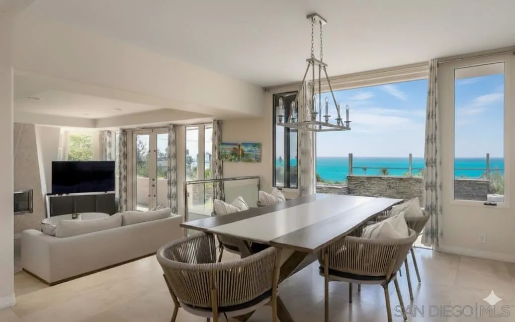 1722 Seaview Avenue Del Mar, CA 92014 - Photo 1 of 31 a dining room with furniture a chandelier and wooden floor