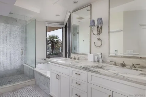 a bathroom with a granite countertop sink mirror and double