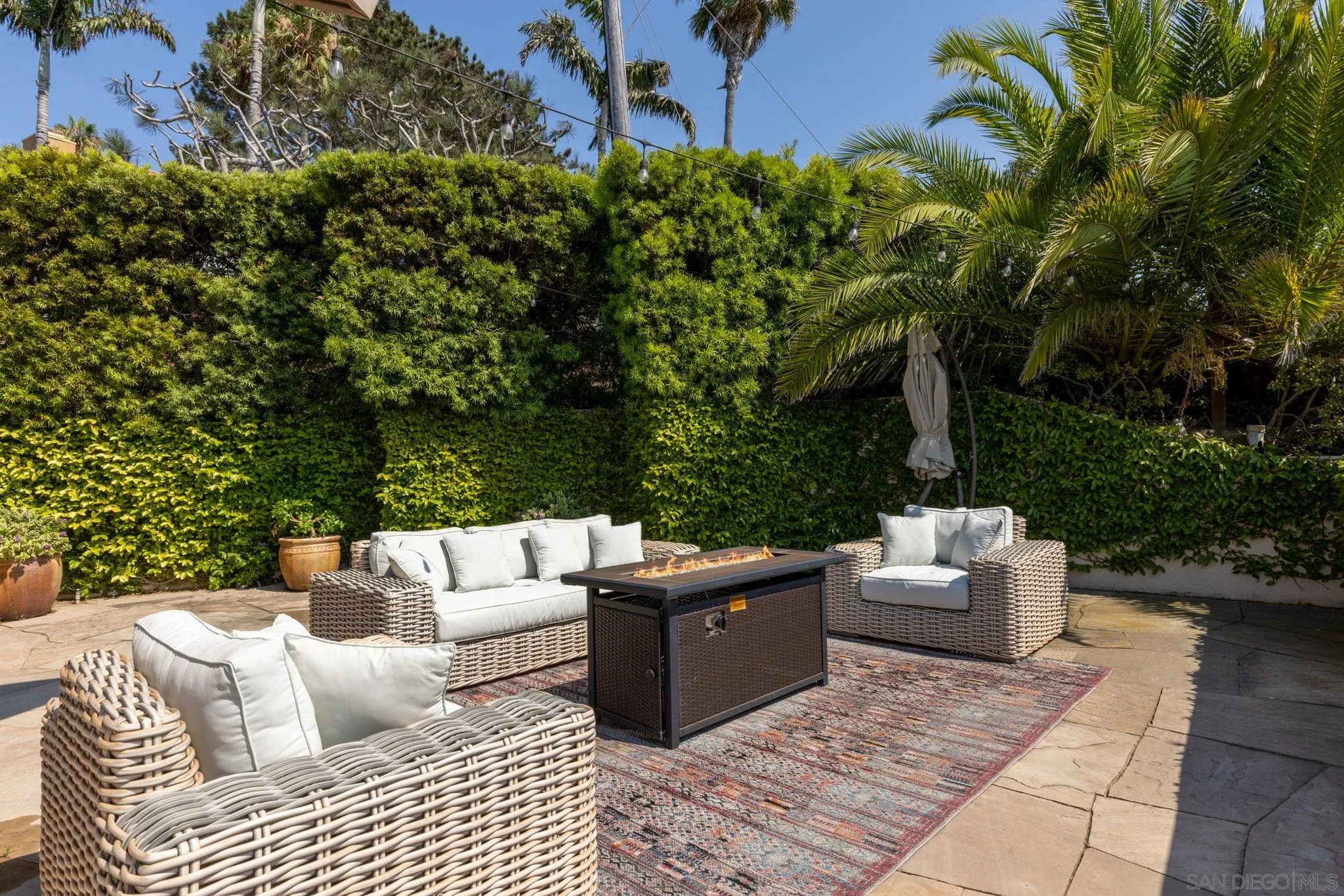 1722 Seaview Avenue Del Mar, CA 92014 - Photo 22 of 31 a view of backyard with couch and outdoor seating