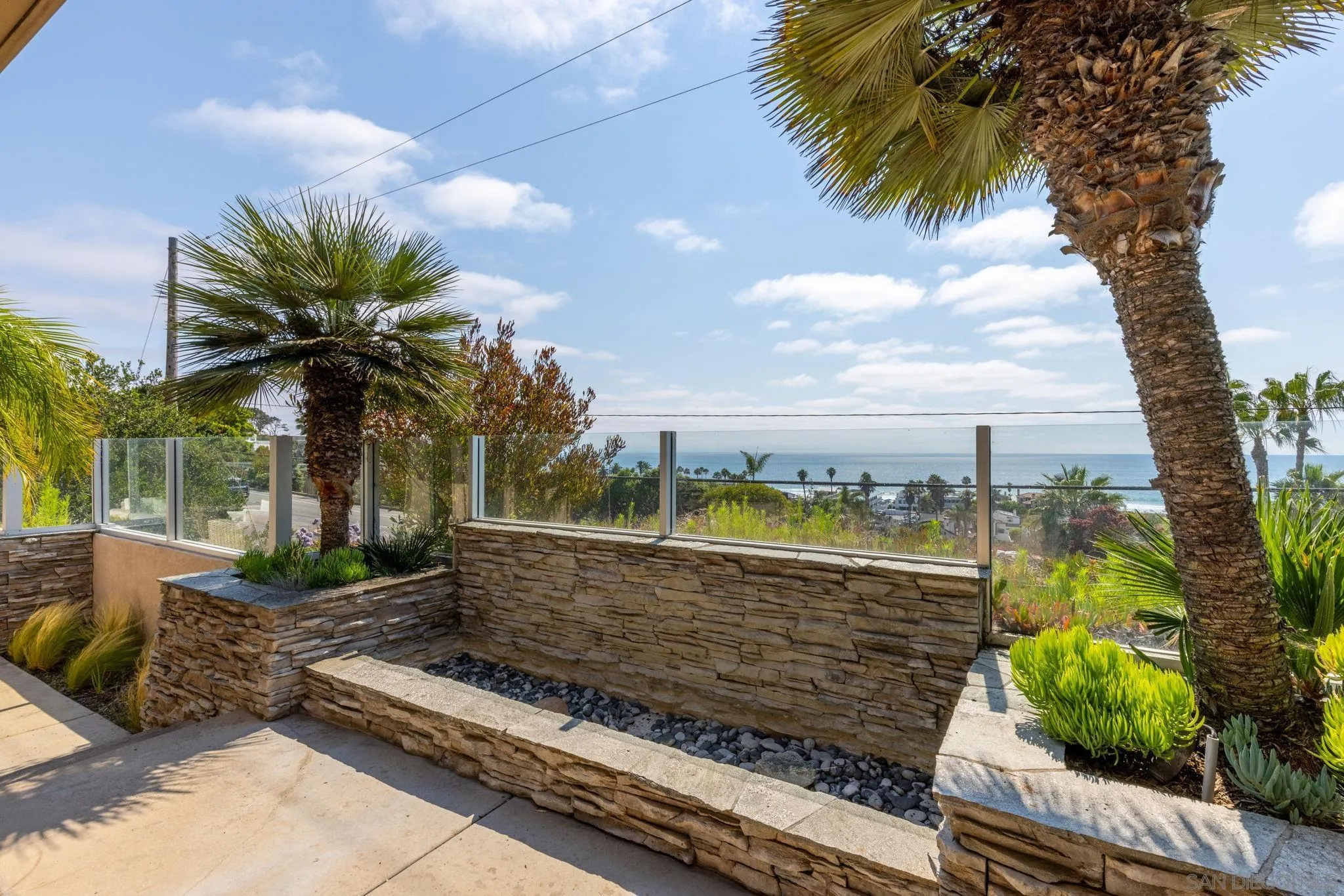 1722 Seaview Avenue Del Mar, CA 92014 - Photo 25 of 31 a view of a garden with a tree