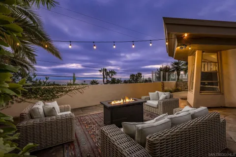 a terrace of a house with outdoor seating