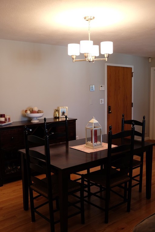 39 Parlin Street, Unit 605 Everett, MA 02149 - Photo 13 of 21 a view of a dining room with a table and chairs