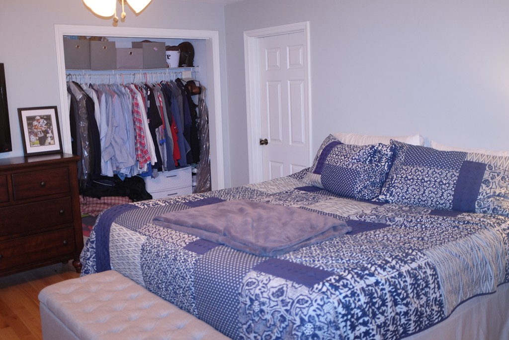 39 Parlin Street, Unit 605 Everett, MA 02149 - Photo 14 of 21 a bedroom with a bed and a walk in closet