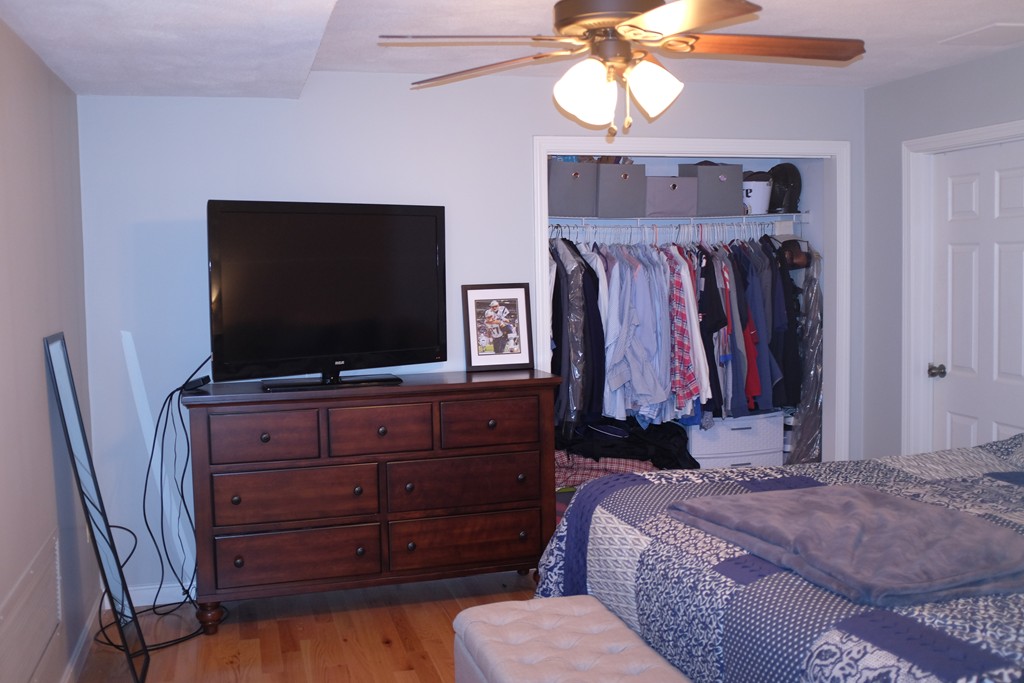 39 Parlin Street, Unit 605 Everett, MA 02149 - Photo 15 of 21 a bedroom with a bed and a flat screen tv