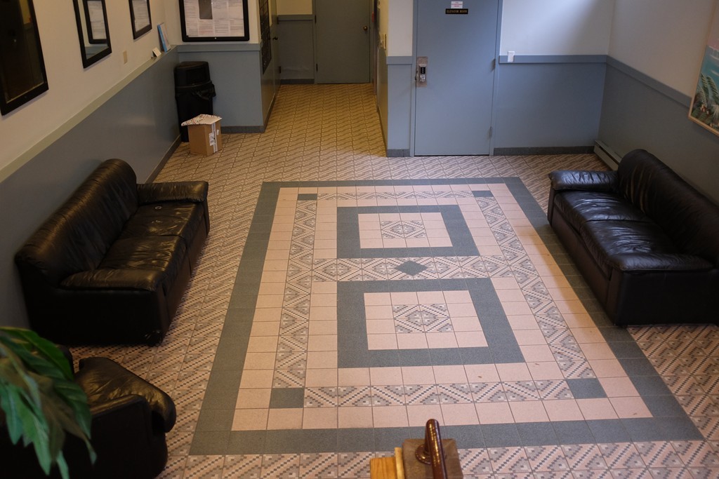 39 Parlin Street, Unit 605 Everett, MA 02149 - Photo 2 of 21 a view of a hallway with wooden floor and staircase