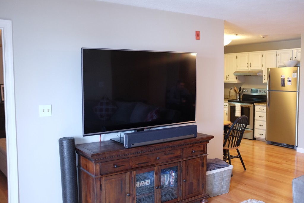 39 Parlin Street, Unit 605 Everett, MA 02149 - Photo 8 of 21 a living room with stainless steel appliances kitchen island granite countertop a stove and a microwave