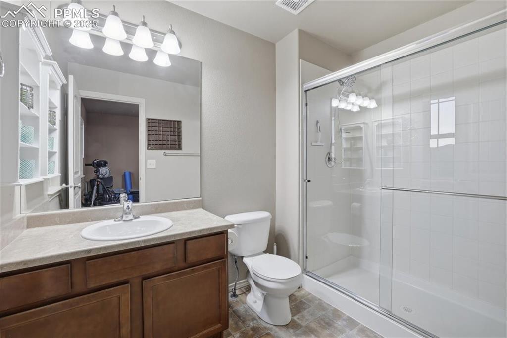 2374 Cinnabar Road Colorado Springs, CO 80921 - Photo 39 of 48 The junior suite has a private 3/4 bath with a large shower.