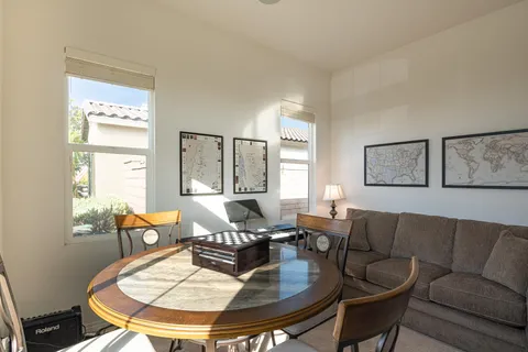 a living room with furniture and a table