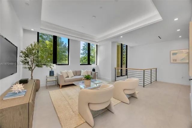 a spacious bedroom with a large bed and a large window