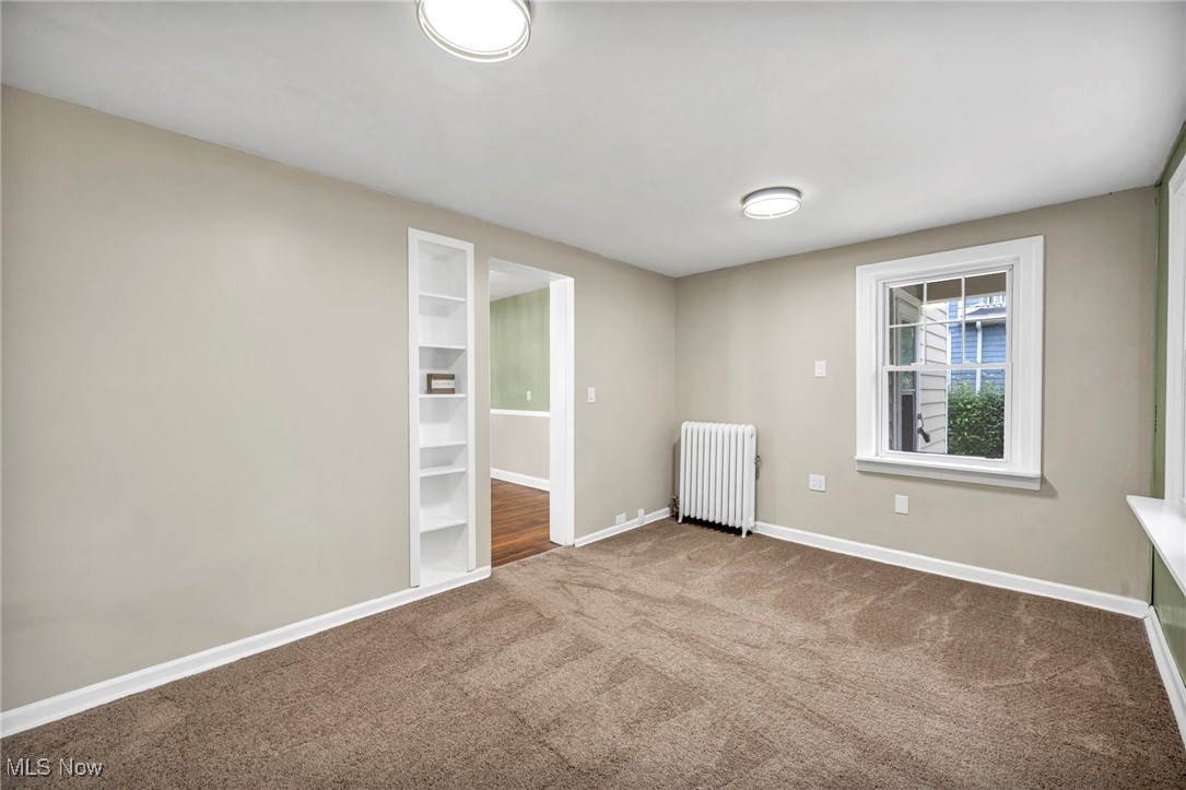 2980 East Overlook Road Cleveland, OH 44118 - Photo 33 of 49 Carpeted empty room featuring radiator