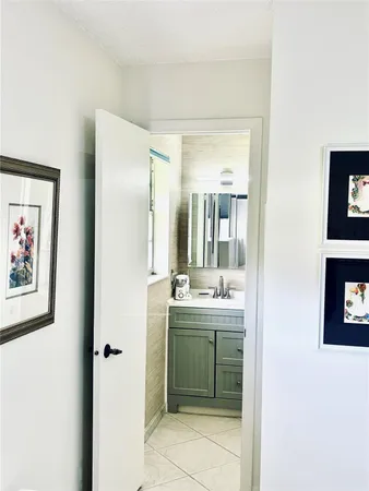 a bathroom with a sink and mirror