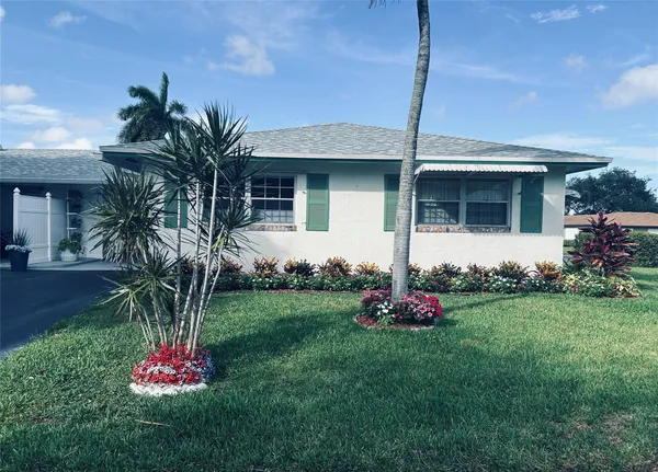 a front view of house with an outdoor space