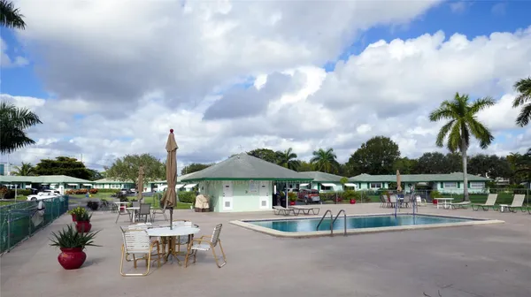 a view of house with outdoor seating space