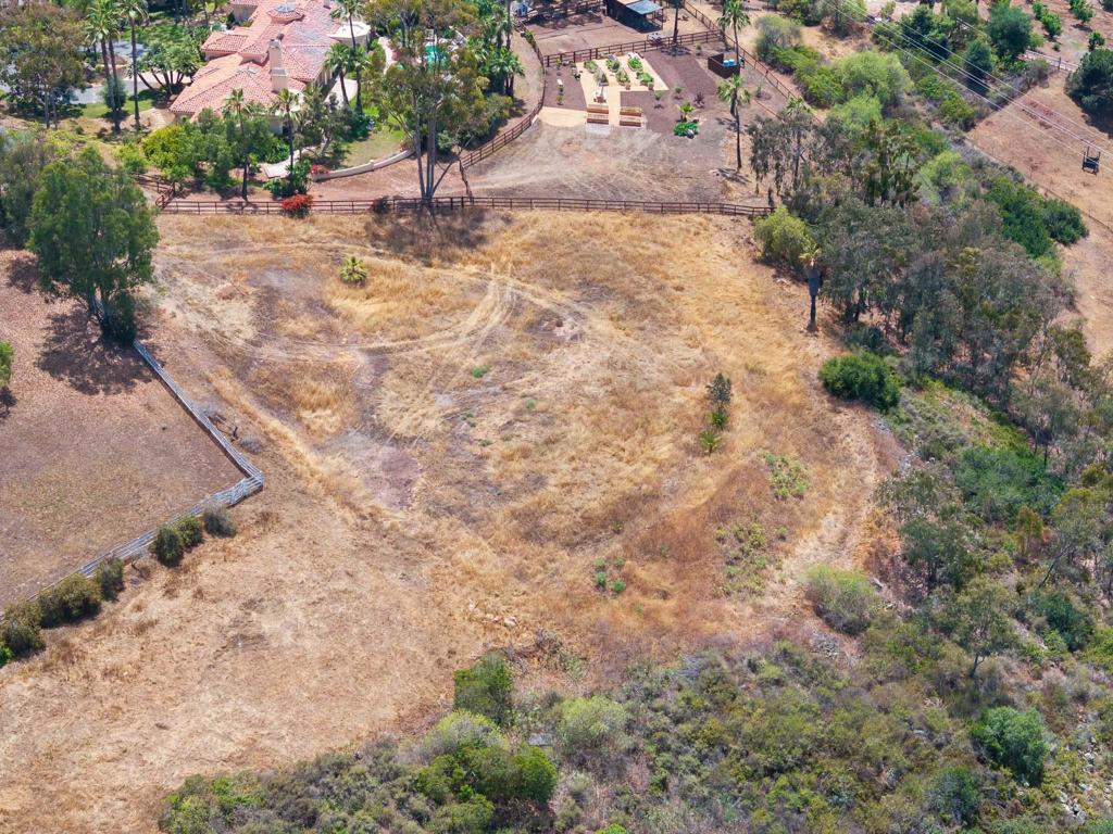 18096 Loma Alegre Rancho Santa Fe, CA 92067 - Photo 8 of 12 a backyard of a house with yard and outdoor seating