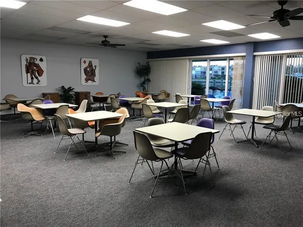 a group of people sitting in a living room
