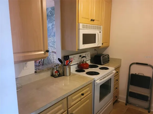 a kitchen with a stove and a microwave