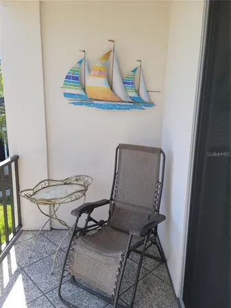 a view of a workspace with furniture and wooden floor