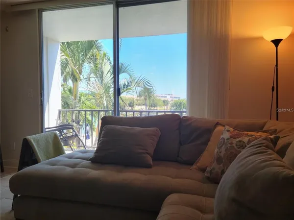 a living room with furniture and a large window
