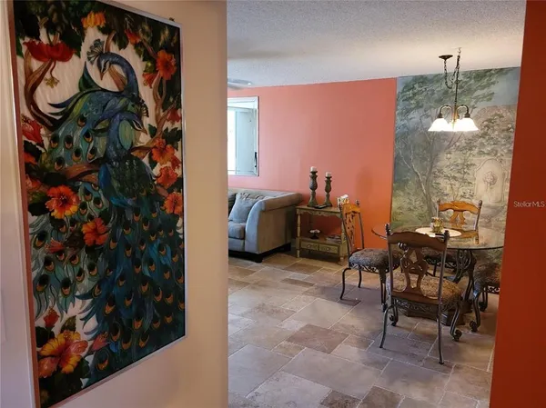 a workspace with furniture and a potted plant