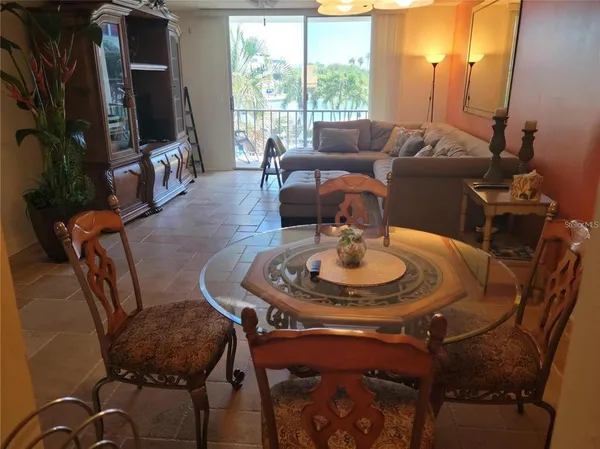 a dining room with furniture and wooden floor