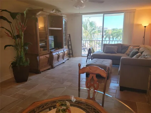 a living room with furniture and a large window