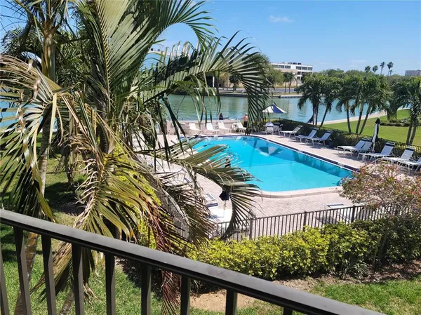 a view of a swimming pool with a patio