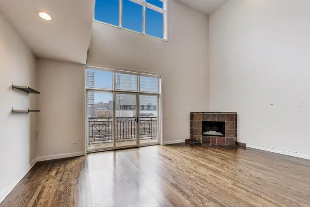 a view of room with wooden floor