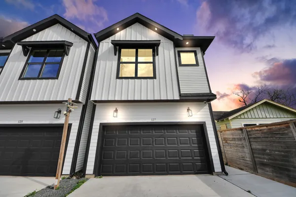 a front view of a house with a garage